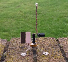 Satellite-like robot with flashing LED.